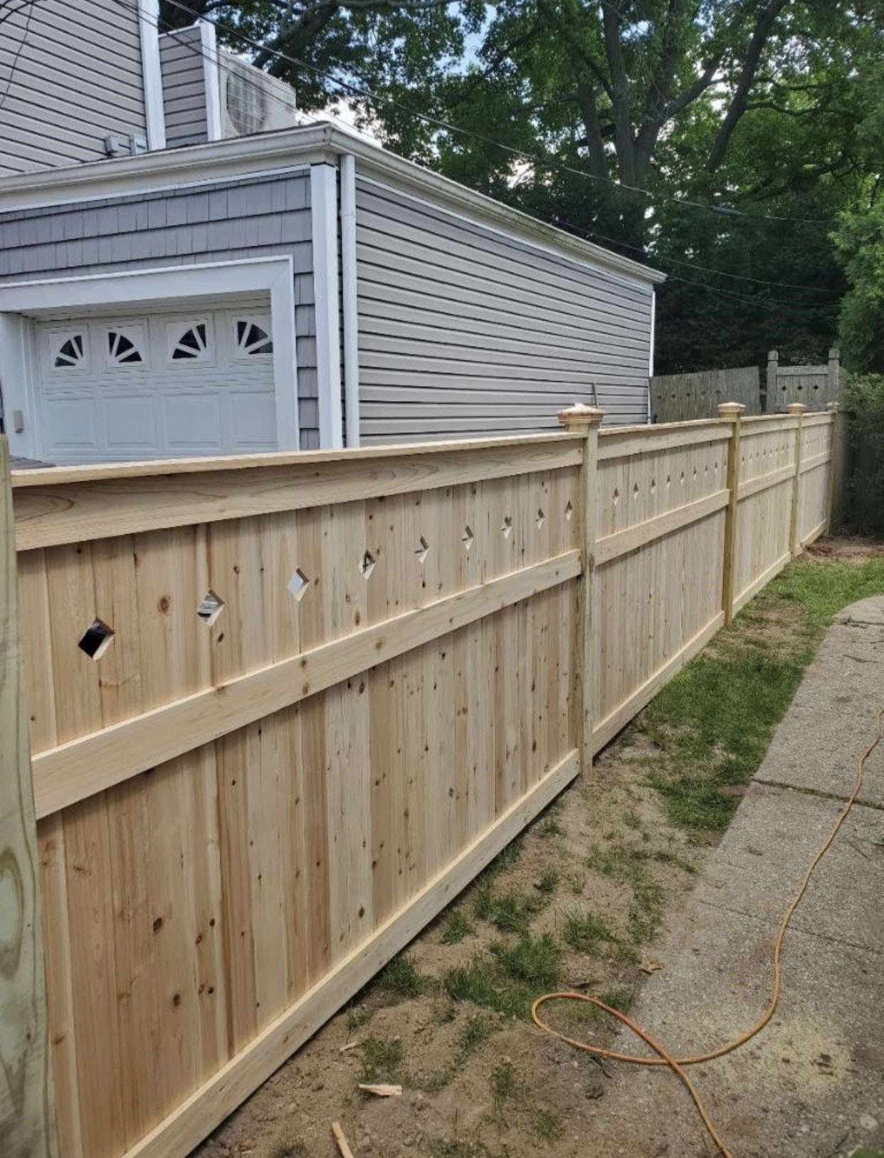 Modern horizontal wood slat fence