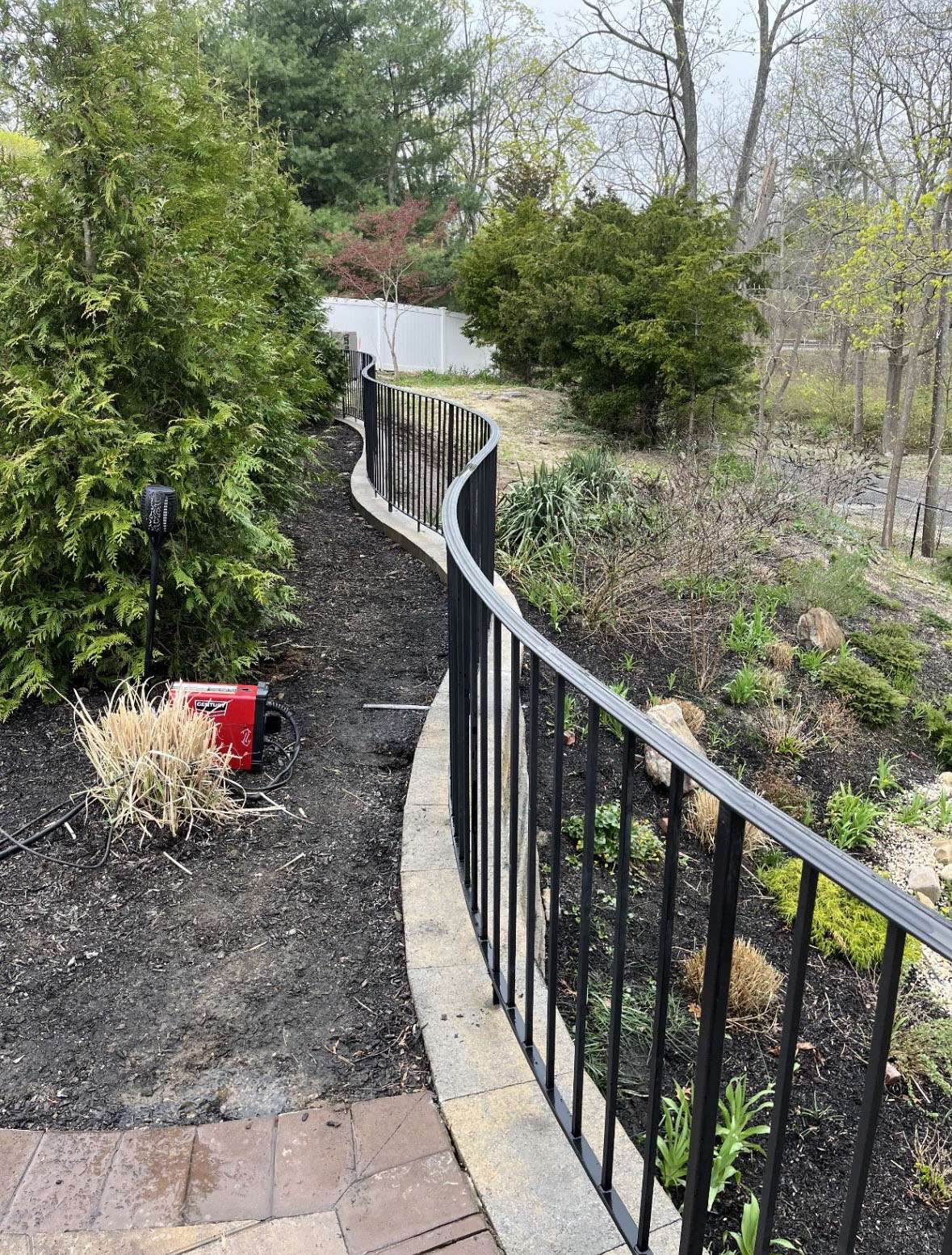 White vinyl picket fence in a Long Island yard